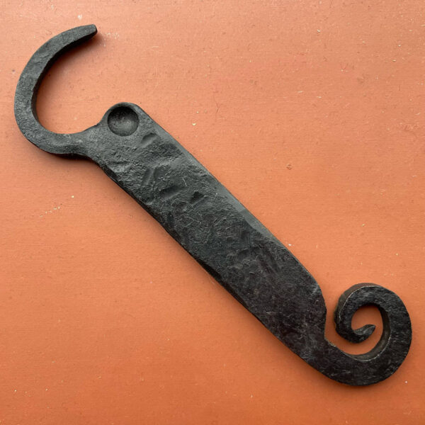 Bottle opener with spiral tail